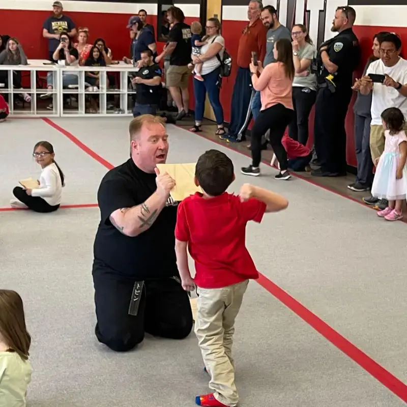 student practicing punches for taekwondo lessons for preschool