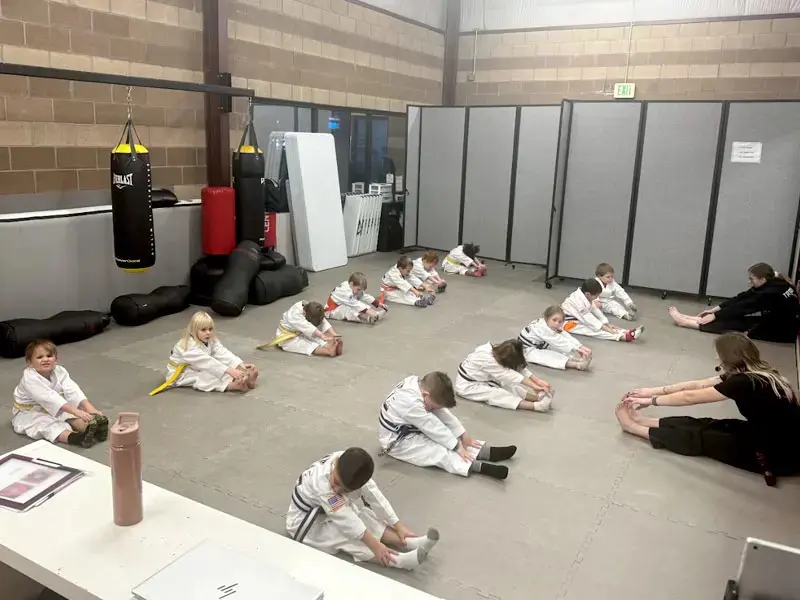 students stretching for preschool taekwondo classes